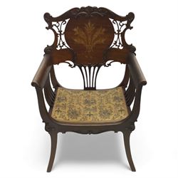 Art Nouveau mahogany open armchair in the manner of Shapland & Petter, the shaped and pierced back with foliate cresting and central panel inlaid with stylised marquetry plume, curved arms over upholstered seat, raised on sabre legs