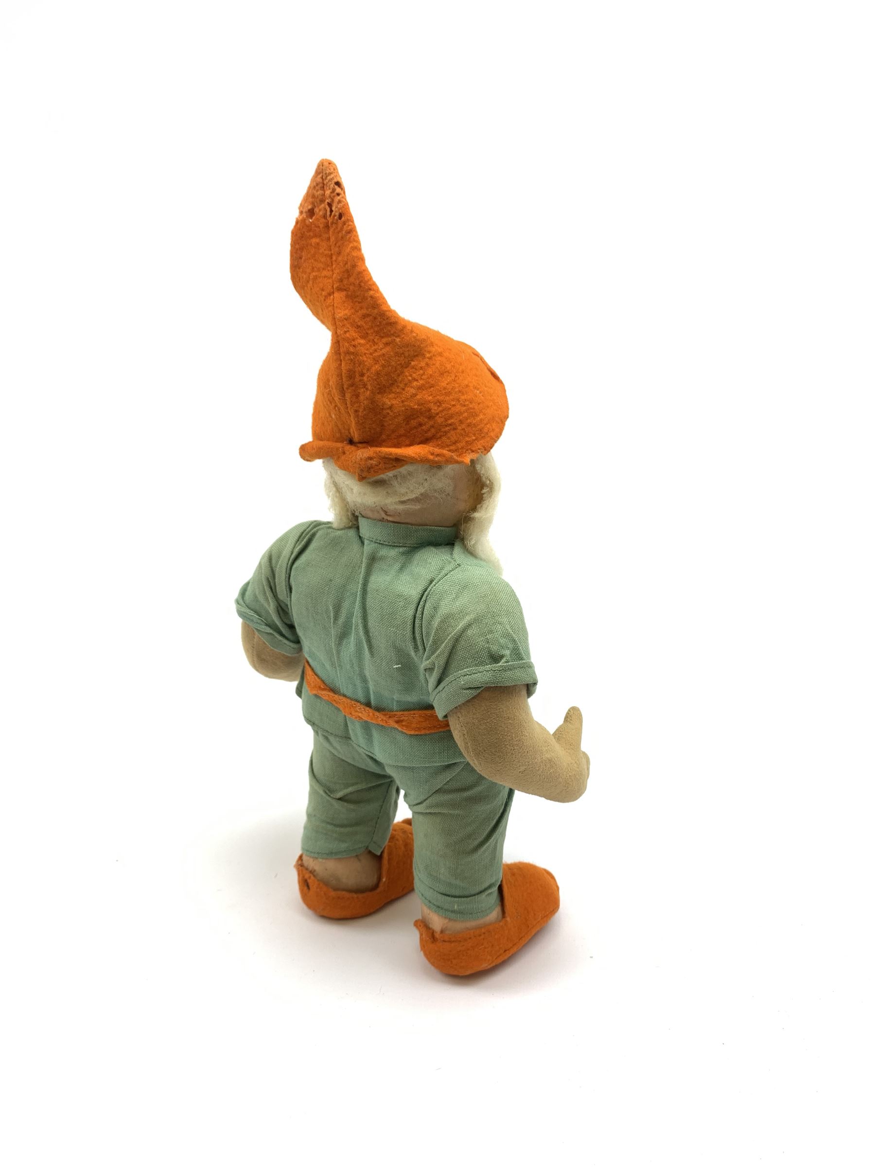 Chad Valley pressed felt figure of the Disney Snow White dwarf 'Doc' with painted facial features, standing wearing a green linen suit with orange hat, belt, buttons and shoes H13