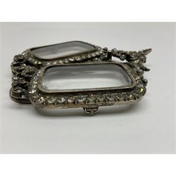 Early 19th century silver plated double photograph frame, each rounded rectangular aperture surrounded by a paste border, with ornate scroll feet and mantling also set with clear paste stones, with easel style support verso, H12cm