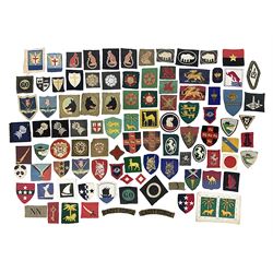Approximately one-hundred printed and embroidered cloth badges including Royal Tank Regiment, Royal Armoured Corps, 219th Independent Infantry Brigade, Cyrenaica, Cyprus, Singapore and other districts, Gibraltar Garrison, East Anglian Brigade, 20th Armoured Brigade and various armoured divisions etc