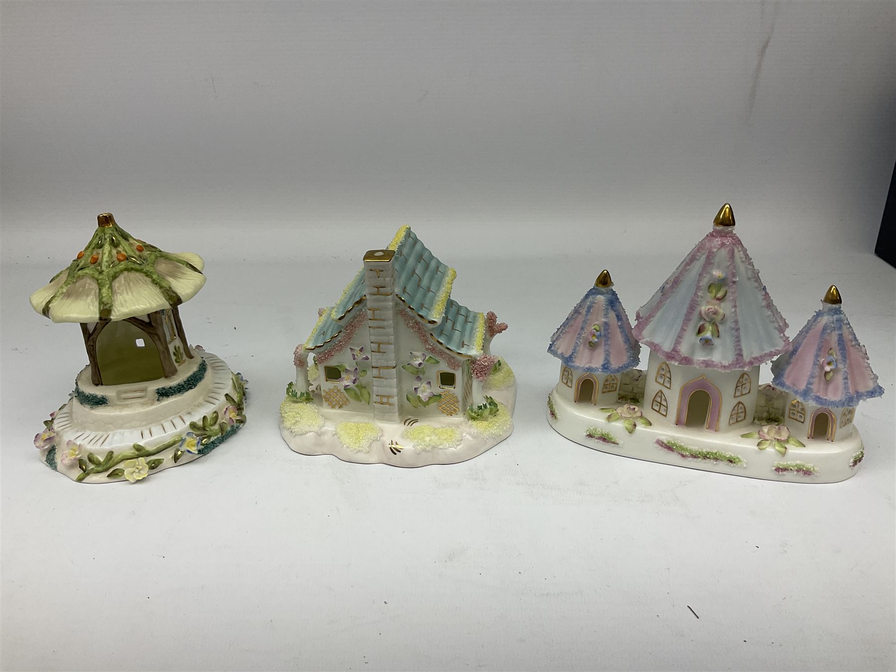 Twelve Coalport bone china pastille burner cottages, to include Fortune Towers, Summer Palace, The Vinery, Springtime Cottage, Dream Villa, Half Moon House, etc, all with original boxes and some with certificates 