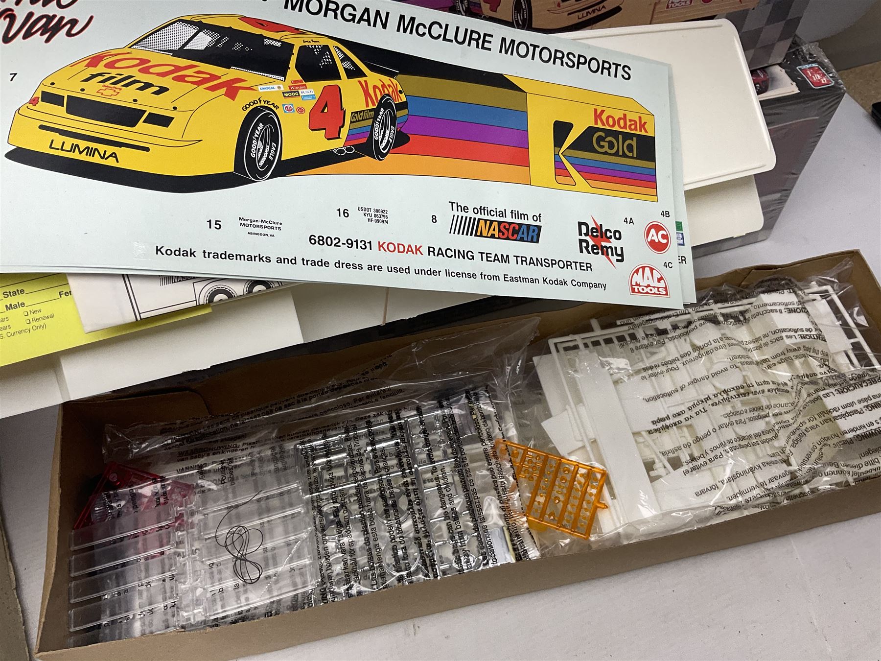 AMT Stock Car Transporter, Kodak Film Racing Team Transporter and Galles-Kraco Indy Car Transporter, Bugatti model etc, all boxed