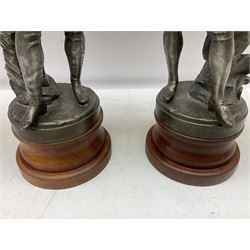 After S. Kinsburger, pair of early 20th century polished spelter figures of Lord Nelson and Arthur Wellesley, each depicted wearing full uniform and standing beside a rock; inscribed S. Kinsburger H39cm; on later turned mahogany bases H47cm overall (2)