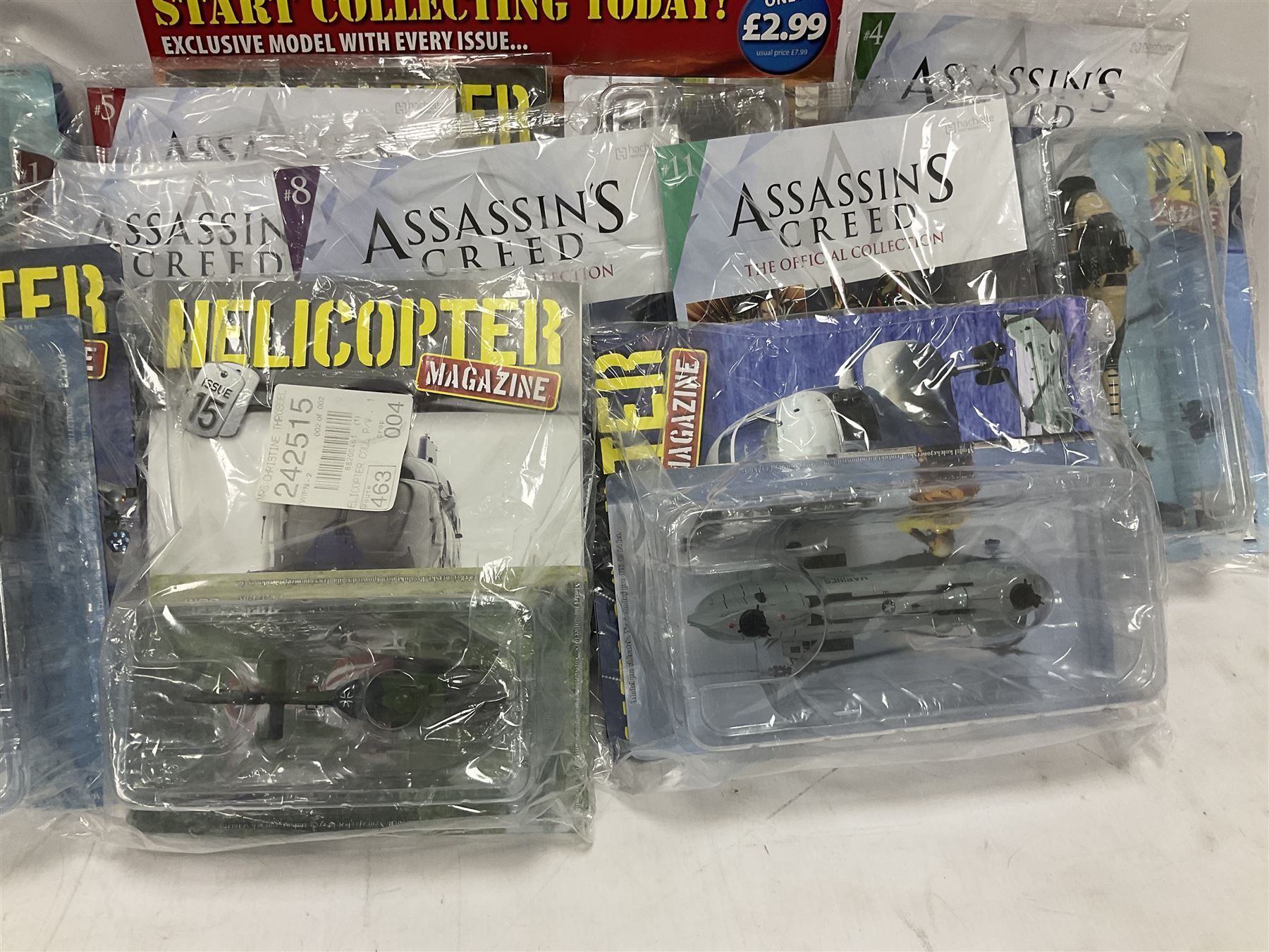 Fifteen Amer Czechoslovakia periodical issued metal models of helicopters each in unopened original packaging with copy of 'Helicopter Magazine'; together with seven unopened Hachette 'Assassin's Creed' periodical figures with magazines (22)