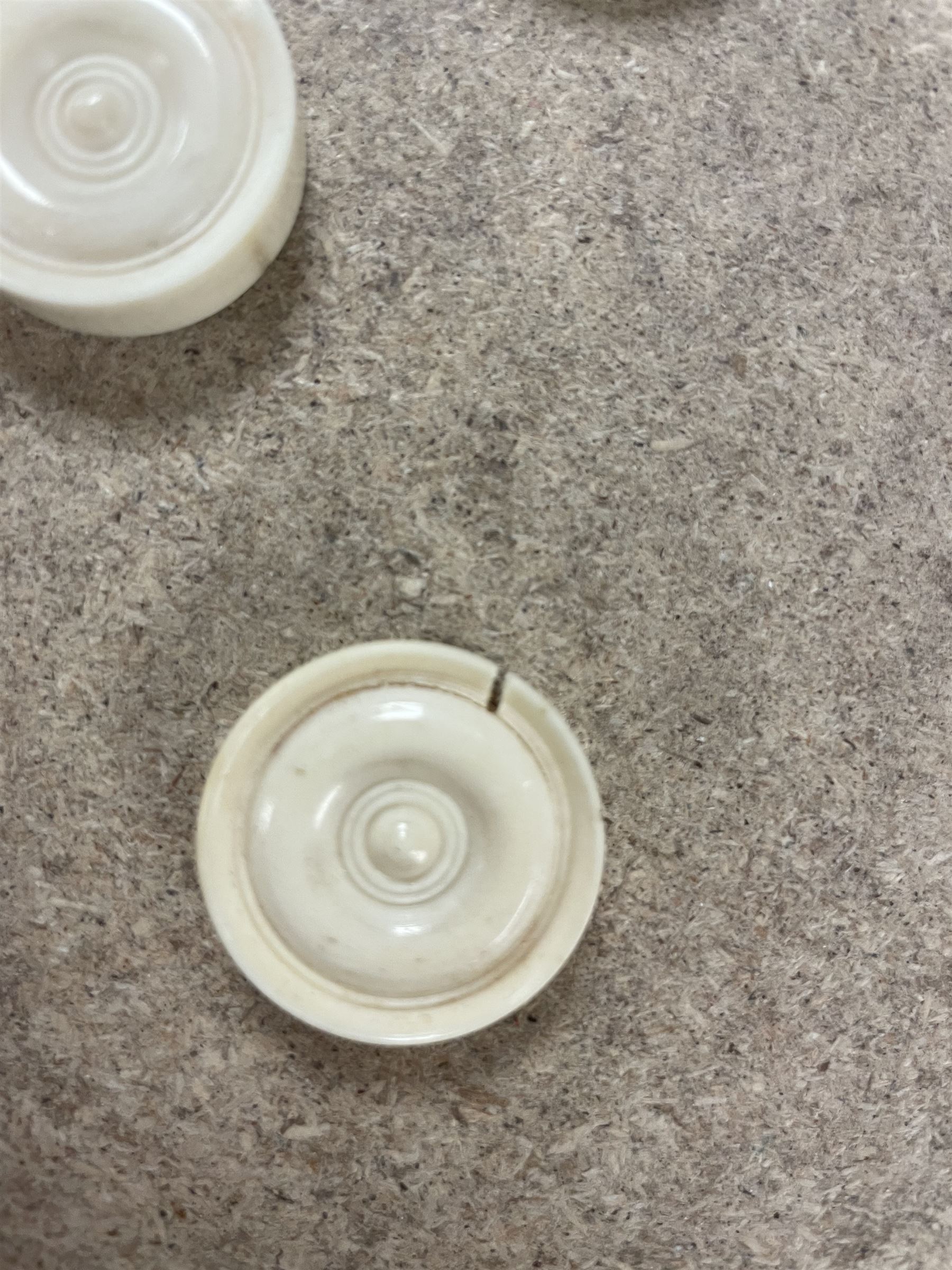 19th century walnut and brass bound games compendium box, painted to enhance the grain, of rectangular form, the hinged opening cover with rounded sides, central brass cartouche with engraved lion crest, and brass riveted straps, opening to reveal a red leather and blue silk lined compartmented interior, with fold-down games board, and lift-out tray containing playing cards, ebony turned dice towers, white and red stained bone draughts, and chess pieces, ivory dice, and ivory and ebony whist markers, and brass bezique board, cribbage board and markers, H15cm W32cm D24cm
This lot has been registered for sale under Section 10 of the APHA Ivory Act