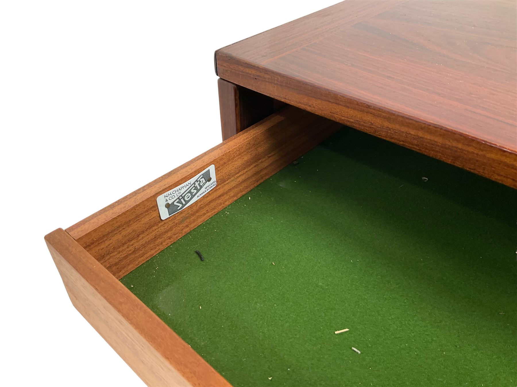 NH Chapman & Co Siesta - mid-20th century sideboard, fitted with three sliding doors, enclosing two drawers and shelves, raised on twin end supports