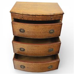 Georgian design bow front chest in figured walnut veneers, with moulded top over a pull-out brushing slide and three long drawers fitted with oval brass drop handles, raised upon swept bracket feet