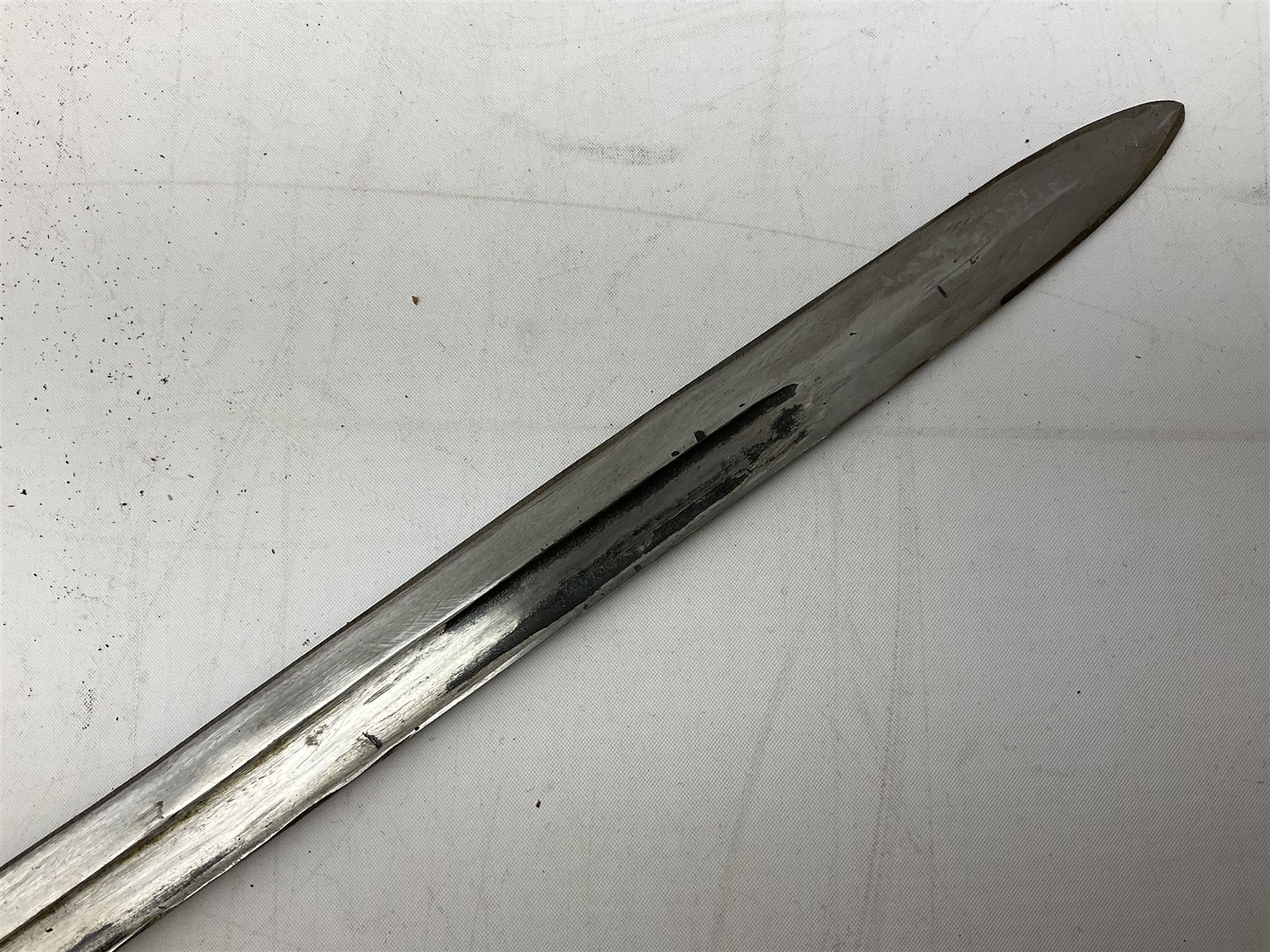 Italian Model 1891 Carcano knife bayonet with 30cm fullered steel blade, the cross-piece stamped VL1110; in steel scabbard with webbing frog L43cm overall; and another Italian fighting knife/bayonet in brass bound leather scabbard (2)