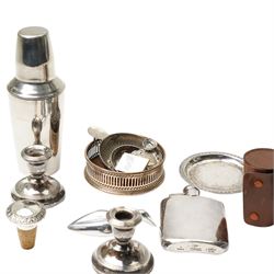 Pair of silver dressing table candlesticks, miniature folding photograph frame, silver port label, plated cocktail shaker and other silver plated items
