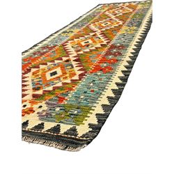 Chobi kilim multi-colour ground runner, the field decorated with lozenges and geometric patterns, within hooked border 