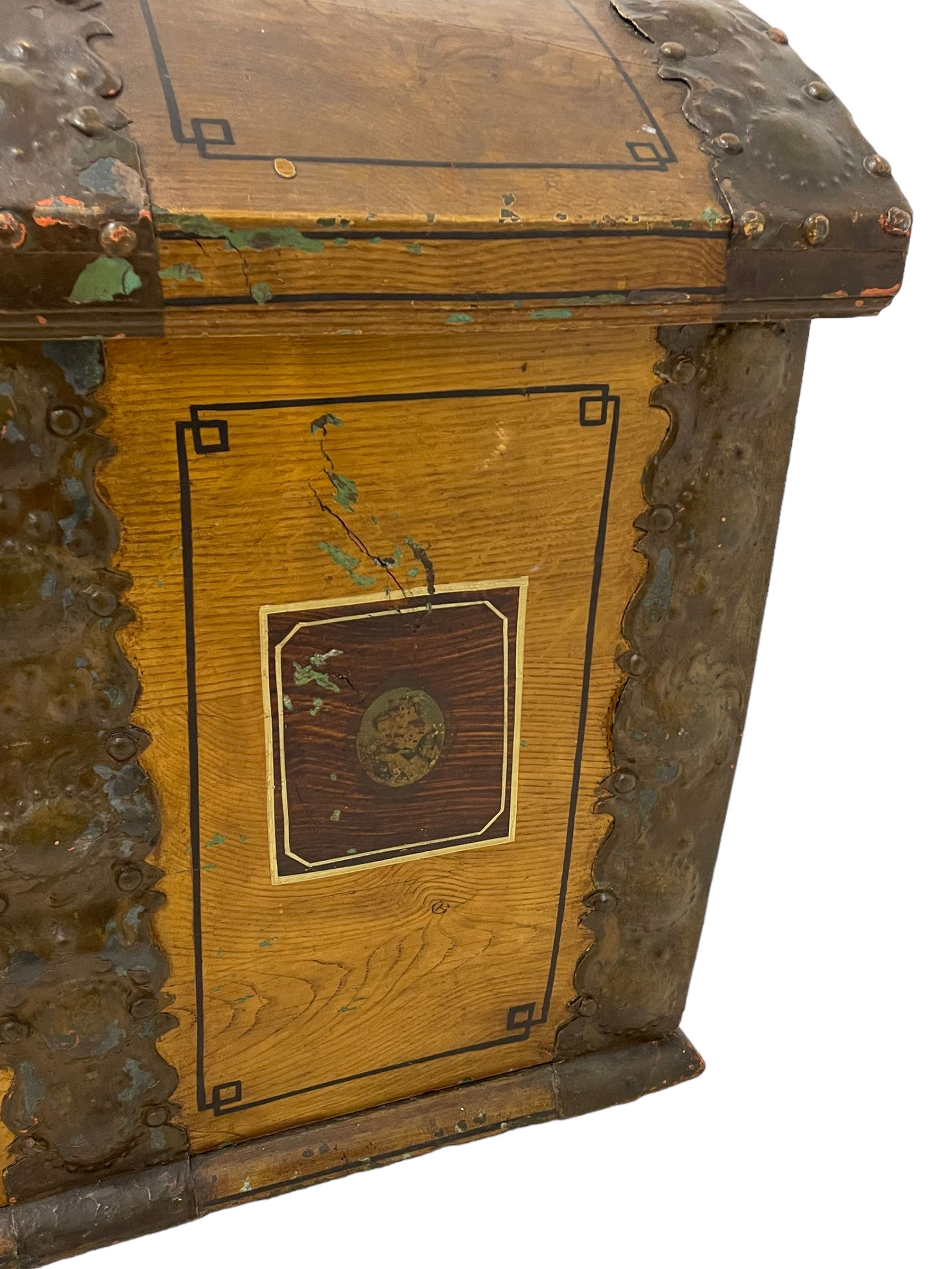 19th century painted oak sea chest, hinged dome top enclosing small compartment, bound by shaped and pressed metal strapwork, scumbled finish to resemble oak and painted with small vignettes depicting portraits and landscapes within panels, fitted with large wrought metal carrying handles, the front inscribed 'H.J.S. 1870' 