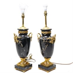 Pair of Louis XVI style black marble and ormolu neoclassical table lamps, mounted on squar...