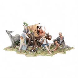 Capodimonte figural group of a gypsy encampment including wagon, cooking fire and people, H21cm