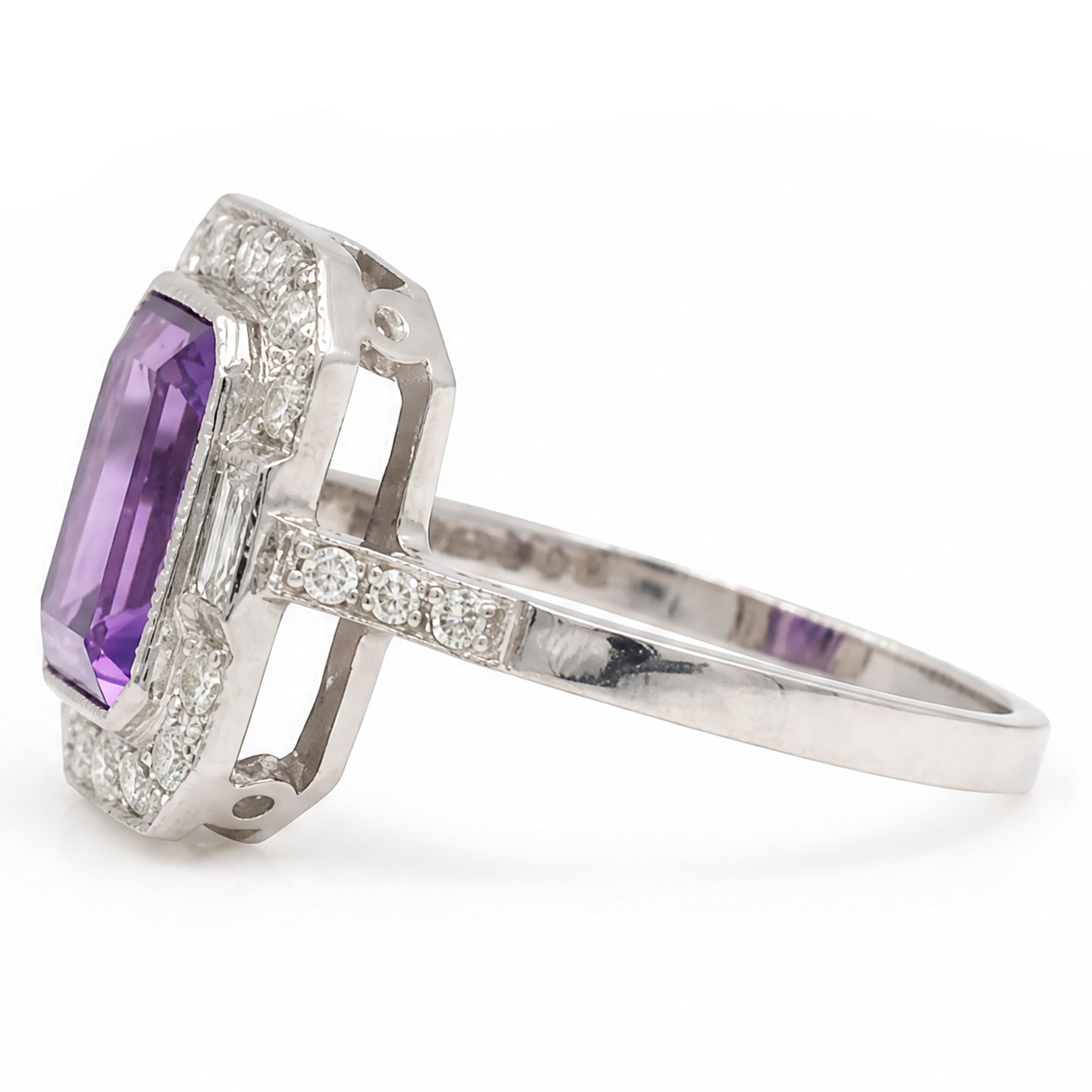 Platinum amethyst and diamond cluster ring, single octagonal cut amethyst  of approx 3.00 carat, surrounded by milgrain set baguette and round cut diamonds and diamond set shoulders, hallmarked, total diamond weight approx 0.25 carat