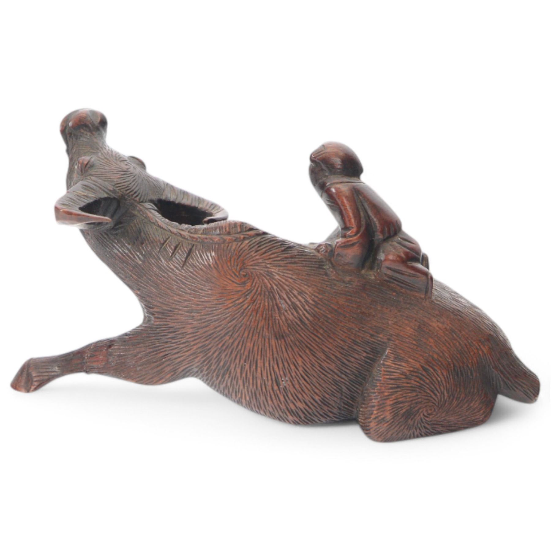Chinese carved hardwood model of an ox or water buffalo, with attendant upon back, upon a carved openwork stand with cabriole lets, model H6.5cm L13cm