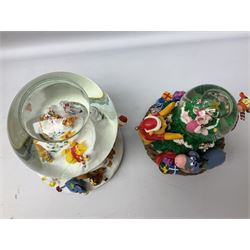 Six Disney Winnie the Pooh Christmas snow globes, comprising large Mr Christmas Holiday Snowfall, An Enchanted Christmas, It's A Small World Christmas 1994,  Tree Trimming, 1995 Christmas At Our House and Christmas Band Concert, together with Mr Christmas Holiday Go Round, all with boxes (7)