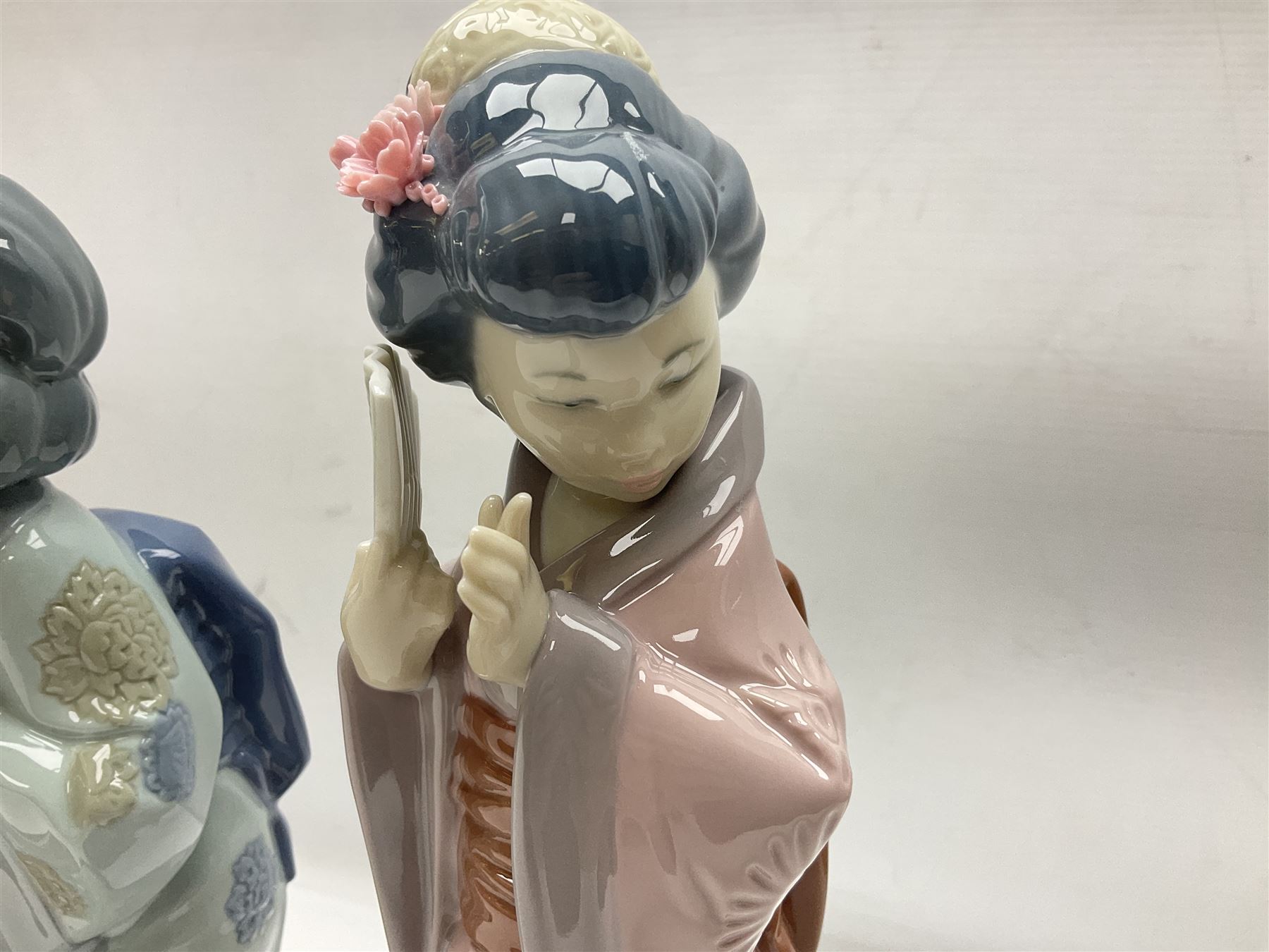 Three Lladro Japanese figures, comprising Sayonara no. 4989, Chrysanthemum no. 4990 and Madame Butterfly no. 4991, largest H30cm