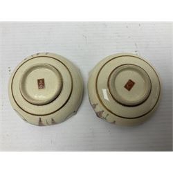 Japanese Satsuma Meiji period vase painted with a mountainous river landscape scene with wisteria and irises; together with a pair of similarly painted small dishes, signature beneath, vase H15cm