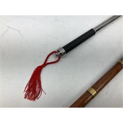 Two replica weapons, consisting of a double headed battle axe and a sword, together with a brass birdhead topped walking stick, stick H67cm