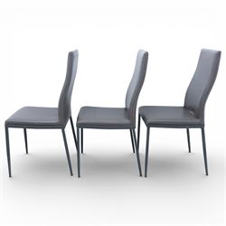 Modern composite marble effect dining table, rectangular top with simulated veining supported on a block pedestal base, accompanied by six matching dining chairs with padded seats and backs in grey upholstery on slim metal legs