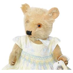 Eight early 20th century and later teddy bears, to include three straw filled examples with jointed limbs, tallest H58cm