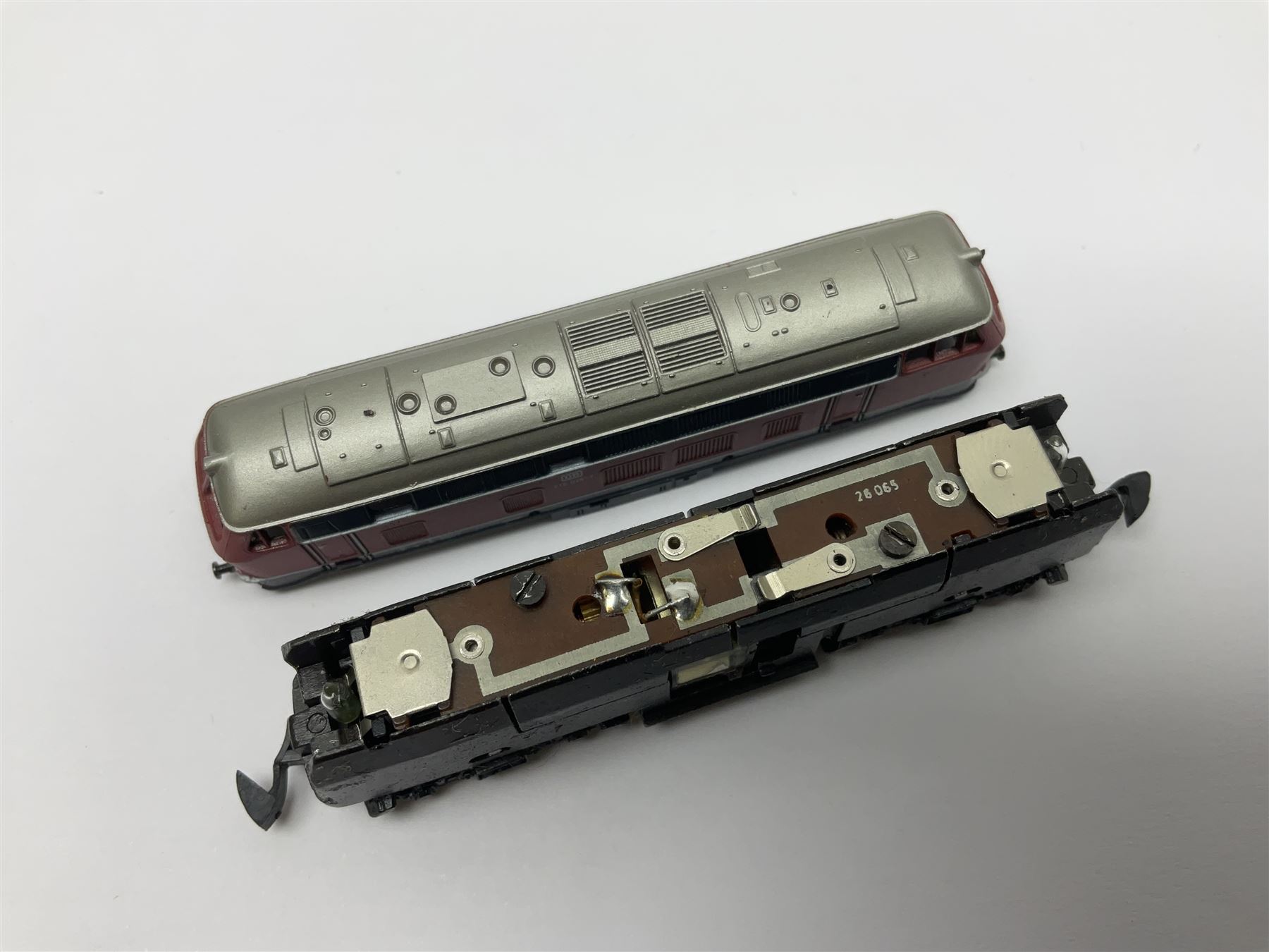 Marklin mini-club 'Z' gauge - DB Diesel Co-Co type locomotive; DB 0-6-0 Rangierlok type shuttle locomotive probably no.8864; and another DB 0-6-0 locomotive probably no.8800; together with an unmarked DB 4-6-2 tender locomotive and DB 2-6-0 tender locomotive; all unboxed (5)