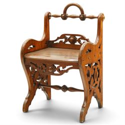 Late 19th century Gothic Revival carved oak hall chair or window seat, the swell-turned to...