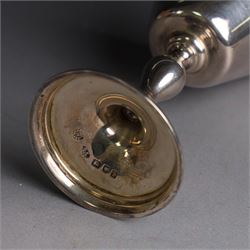 Mid 20th century silver travelling communion set, comprising goblet, paten and pyx, all hallmarked Hurst, Franklin & Co Ltd, London 1961 & 1962, with a glass bottle with unmarked cover, all within a tooled leather fitted case, goblet H9cm