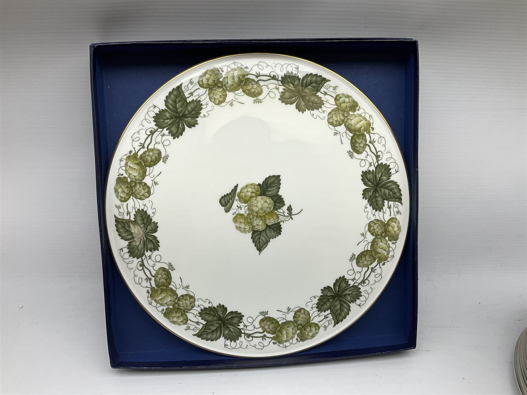 Royal Doulton tea and dinner wares decorated in the Vanity Fair pattern, to include twelve dinner plates, twelve side plates, eleven bowls, three lidded tureens, ten teacups, sauceboat on stand etc, together with boxed Royal Worcester plate, six Royal Worcester ramekins etc