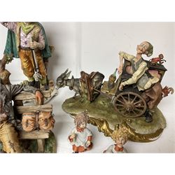 Group of Capodimonte figures, to include musical organ grinder with donkey and monkey, two tramp figures on benches, man with gun and choir boy and girl figures