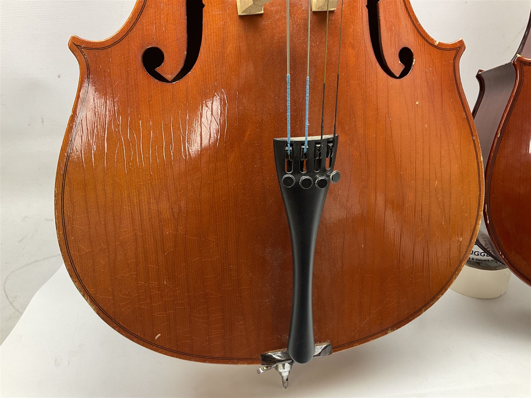 Modern Hungarian half-size cello with 69cm two-piece maple back and ribs and spruce top L114cm overall; and Stentor half size cello bearing label 'The Stentor Student II'; each in soft carrying case (2)