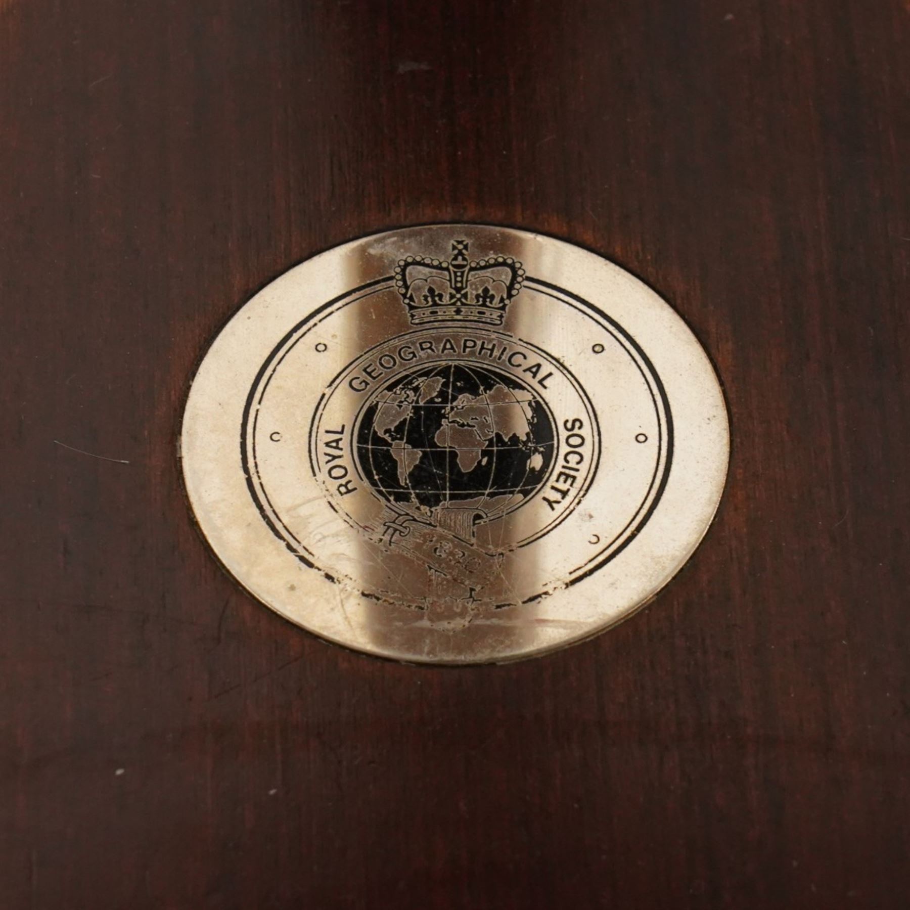 Royal Geographic Society - clock occasional table, the inset brass face with double hemisphere design and glazed top, raised on cylindrical supports united by triform platform base