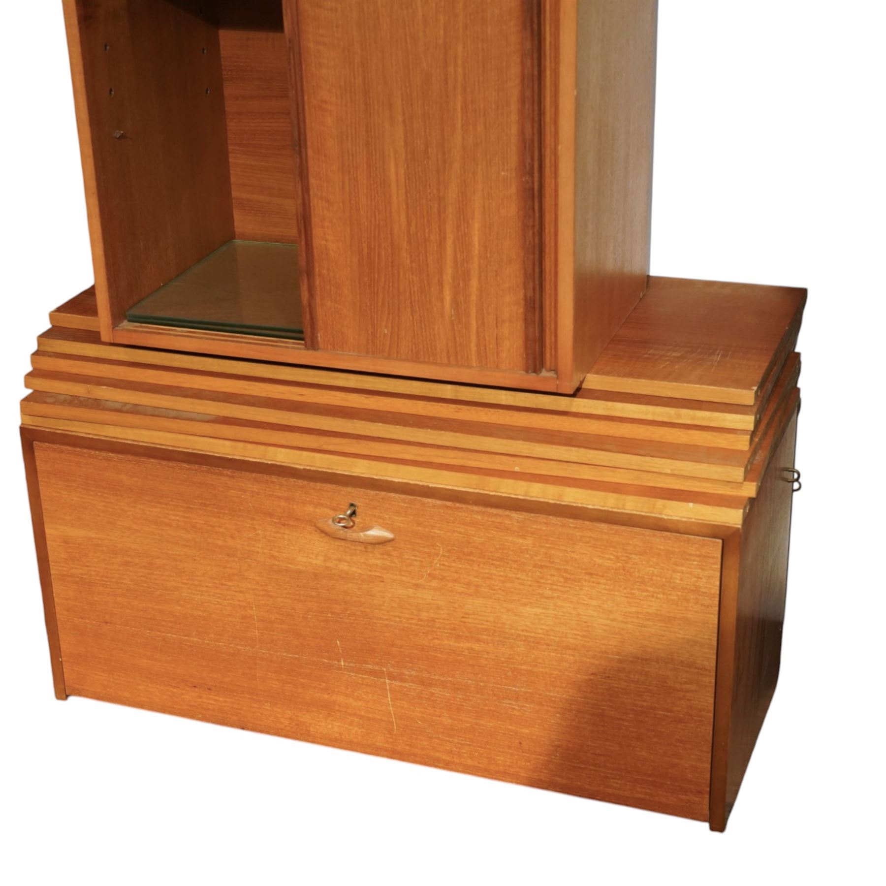 Ladderax - mid 20th century teak modular wall unit, comprising two sliding door cabinets, one fall-front cabinet, six shelves, four ladder supports and fourteen metal cross braces