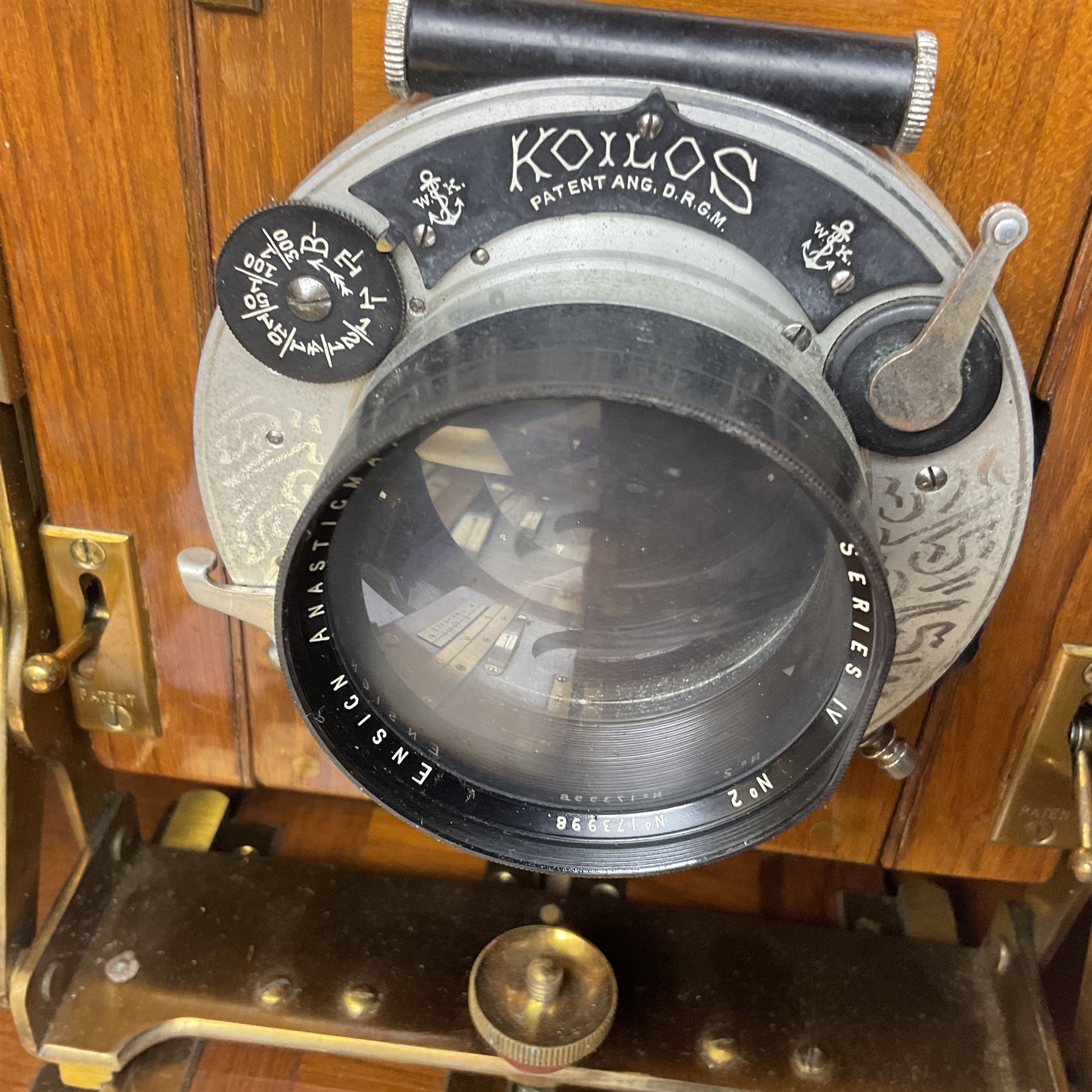 Sanderson Koilos folding plate camera in mahogany and lacquered brass, with 'Ensign Anastigmat Series IV No 2' lens, serial no 173998, with original leather case