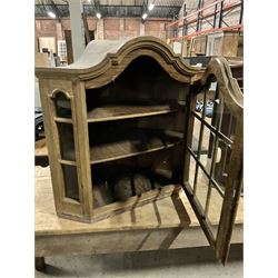 Dutch design oak wall hanging apothecary cabinet, of arched form with single astragal style glazed door enclosing single shelf (W69cm D18cm H69cm); together with another similar of corner form (W75cm D48cm H69cm) - THIS LOT IS TO BE COLLECTED BY APPOINTMENT FROM THE OLD BUFFER DEPOT, MELBOURNE PLACE, SOWERBY, THIRSK, YO7 1QY