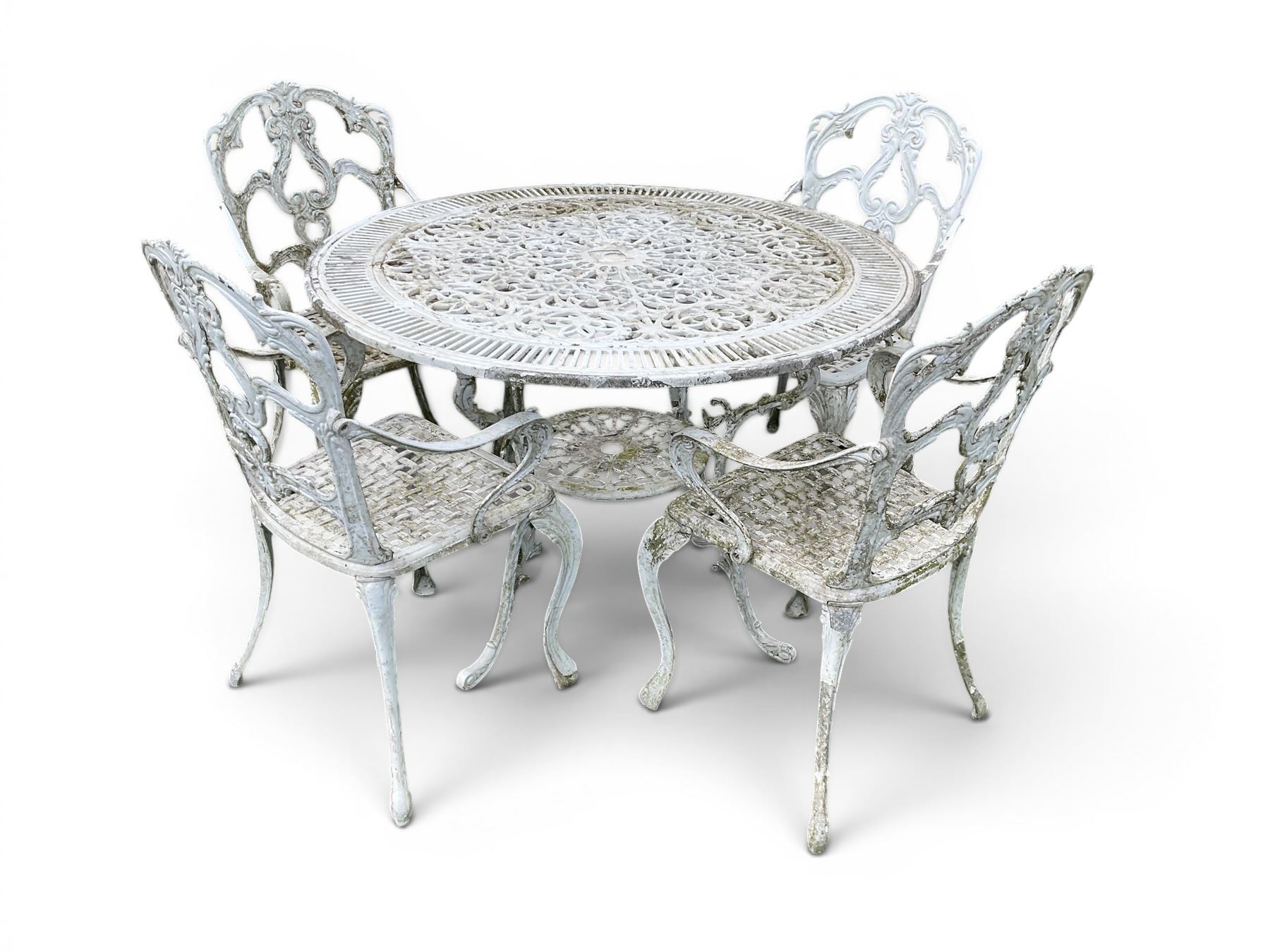 Victorian style cast aluminium white painted garden table and four armchairs chairs with S-scroll acanthus leaf pierced backs over lattice seats
