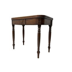 19th century mahogany tea table, rectangular fold-over top with rear gate-leg action, frieze applied with sunburst decoration, on turned supports