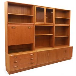 G Plan - Mid 20th century teak sectional wall cabinet, comprising six modular units including a fall front bureau, glazed display cabinet, open bookcase, cupboard and drawer bases, each with recessed handles and flush plinths