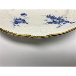 Early 19th century Nantgarw 'Lady Seaton' porcelain plate, circa 1820, hand painted with cobalt blue enamel floral sprays, with shaped and scroll moulded rim within a gilt line, with impressed marks beneath, D25cm