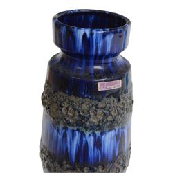 Strathearn glass vase, decorated with multiple swirls against a yellow ground, together with Rudolf Schrötter, blue glass Bullet vase and two other vases 