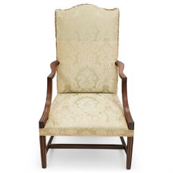 Georgian design mahogany framed Gainsborough armchair, arched cresting rail over shaped arms on curved and moulded supports, upholstered in pale green fabric with repeating foliate pattern, on square tapering moulded supports united by plain stretchers 