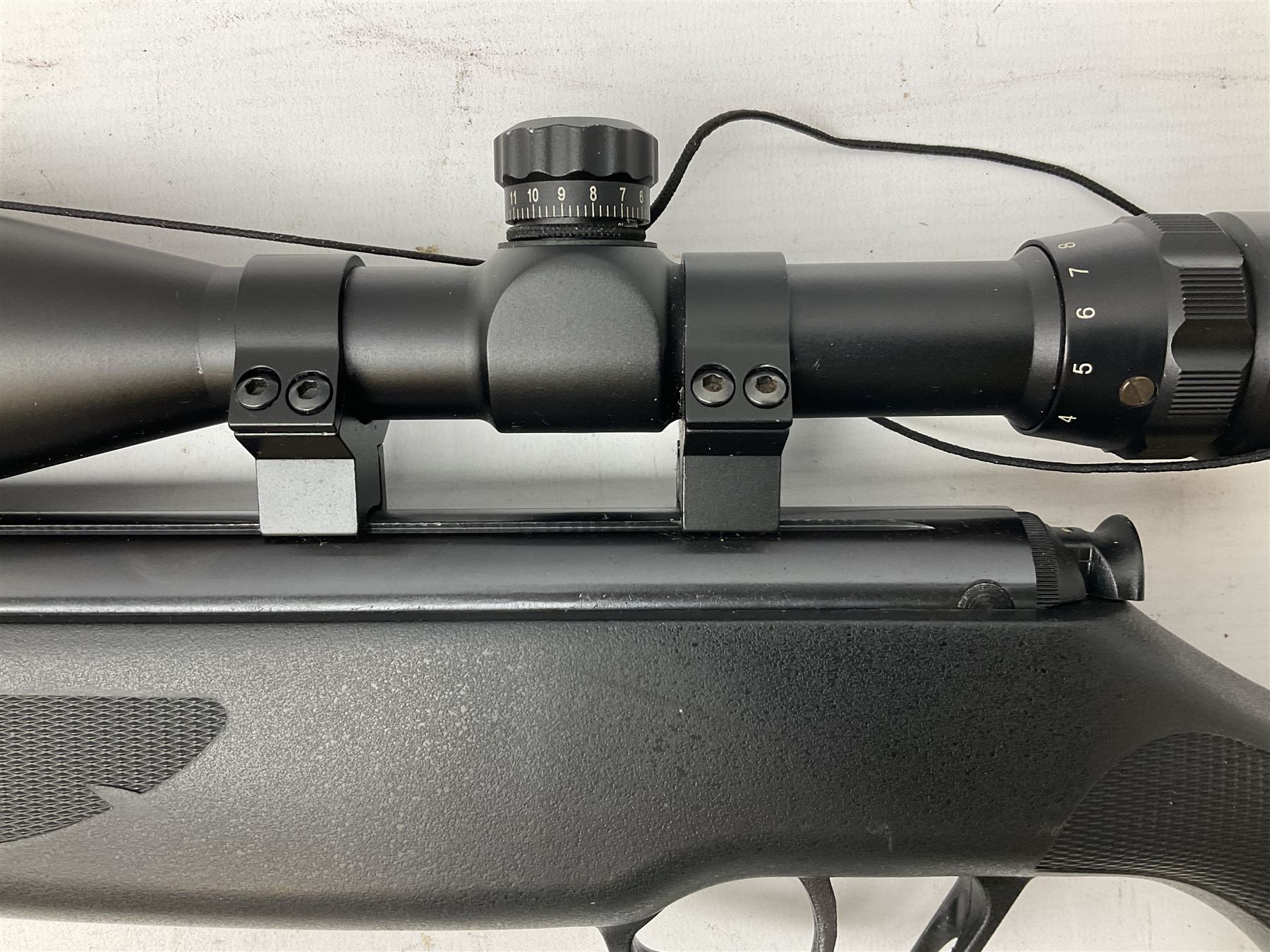 Stoegar .177 air rifle with break barrel action, 3 x 9 telescopic sight and fully integrated sound moderated barrel, no visible serial number, L109cm; in Stoeger lined gun sling