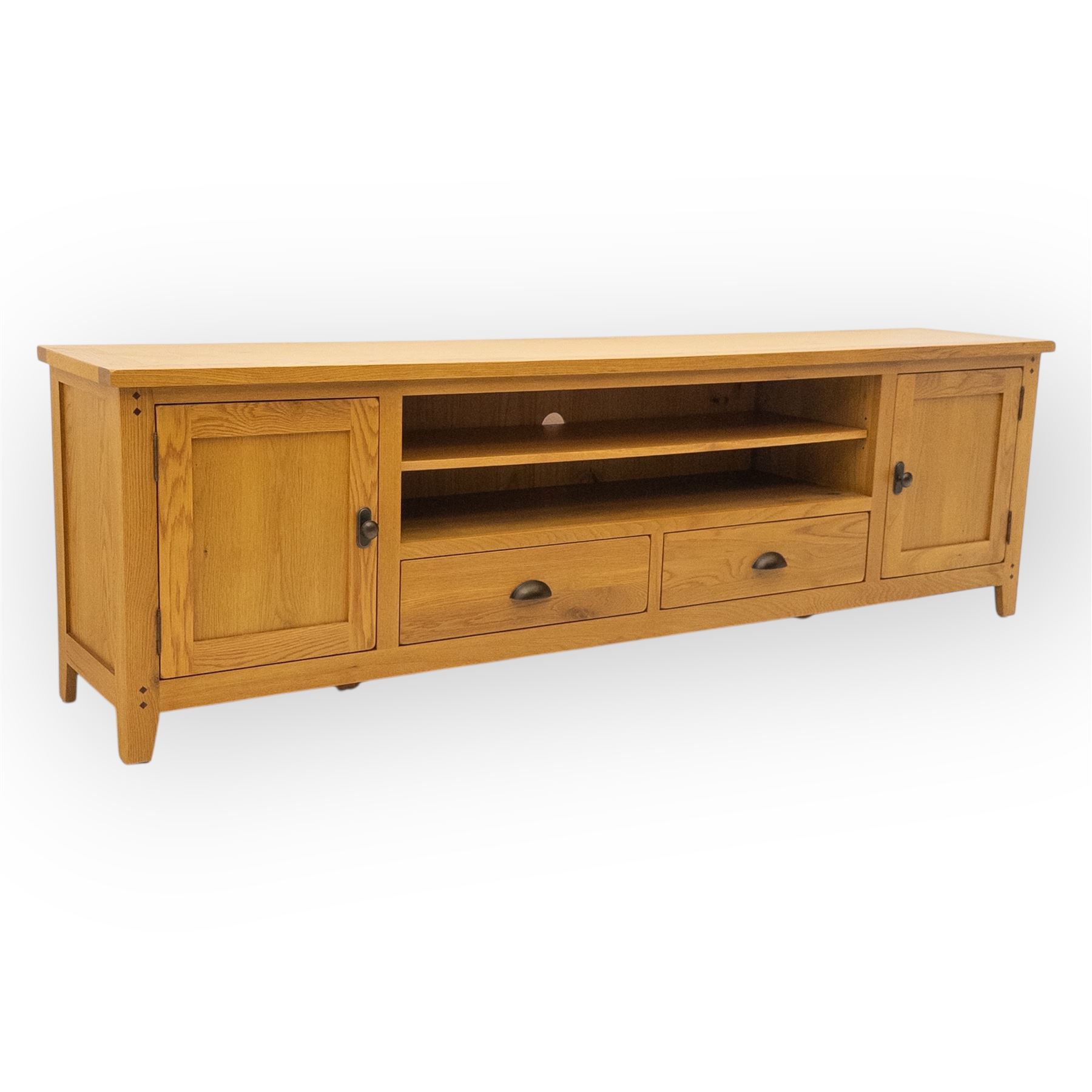 Cotswold & Co - large light oak media stand, rectangular top above central open shelf, double drawer flanked by two panelled cupboard doors, fitted with metal cup and knob handles