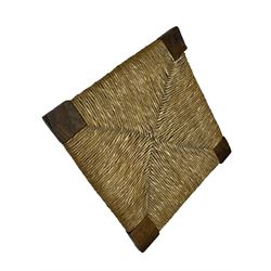 18th century country elm and oak corner chair, the shaped cresting rail terminating to swept arm resets, supported by turned columns and pierced shaped splats, over a drop-in rush seat, raised on square supports united by box stretcher