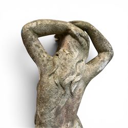 Two composition stone garden figures, comprising a seated boy figure and a standing classical draped female figure, each on square base, weathered painted finish.
