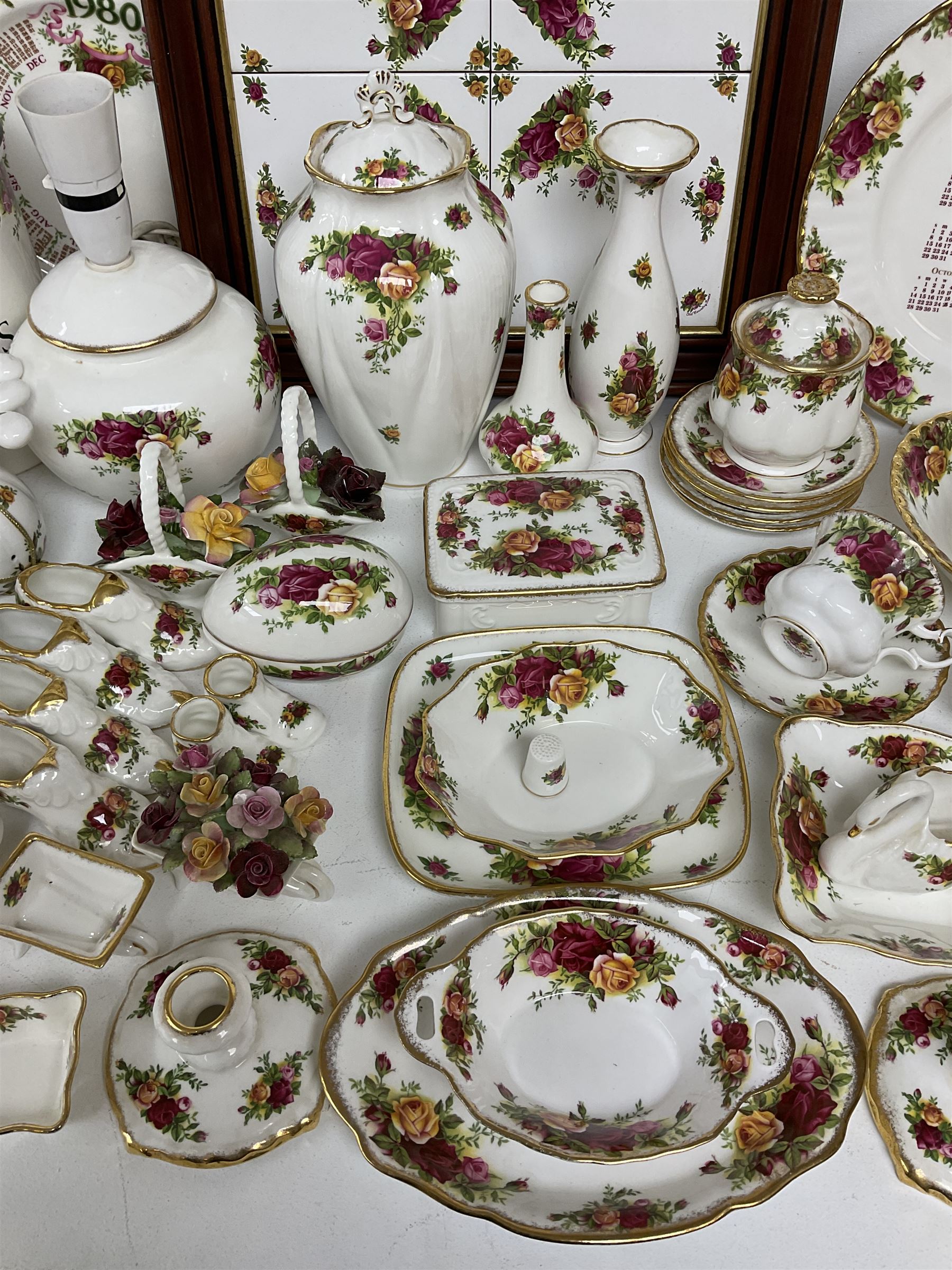 Royal Albert Old Country Roses pattern ceramics, to include table lamp, lidded vase, two pairs of salt and pepper shakers, cups and saucers, plates, biscuit jar, bowls, lidded preserve pot, vases, dishes, knives, napkin rings, lidded jars and box, pair of candlesticks etc