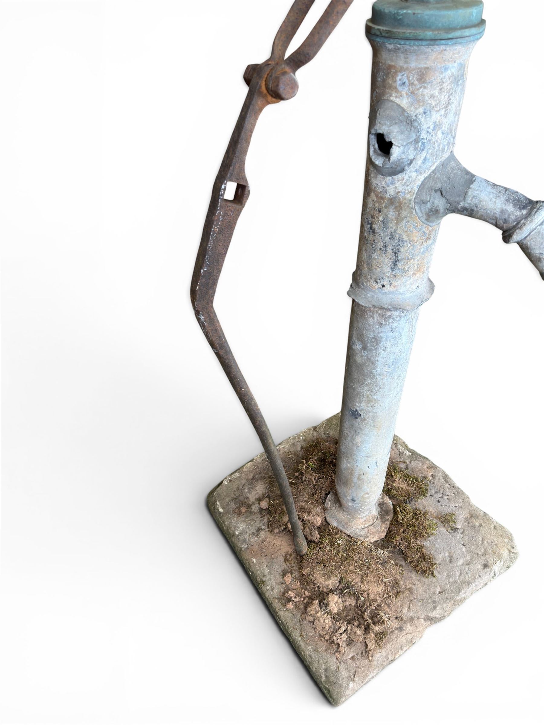 Georgian period lead garden water pump, with iron handle, set in square stone base