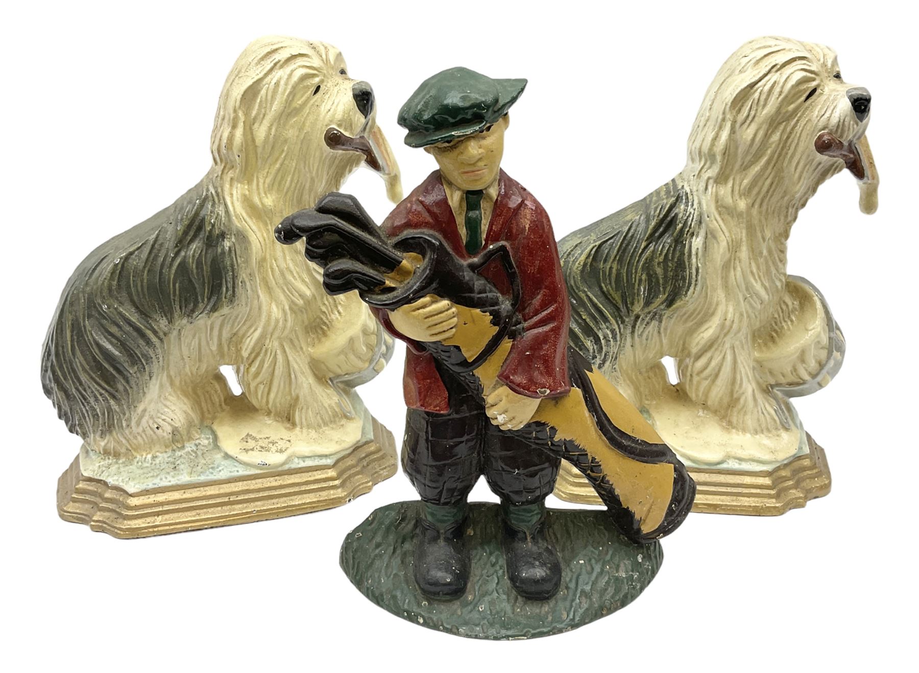 Pair of cast iron Dulux Old English sheepdog doorstops together with another modelled as a golfer