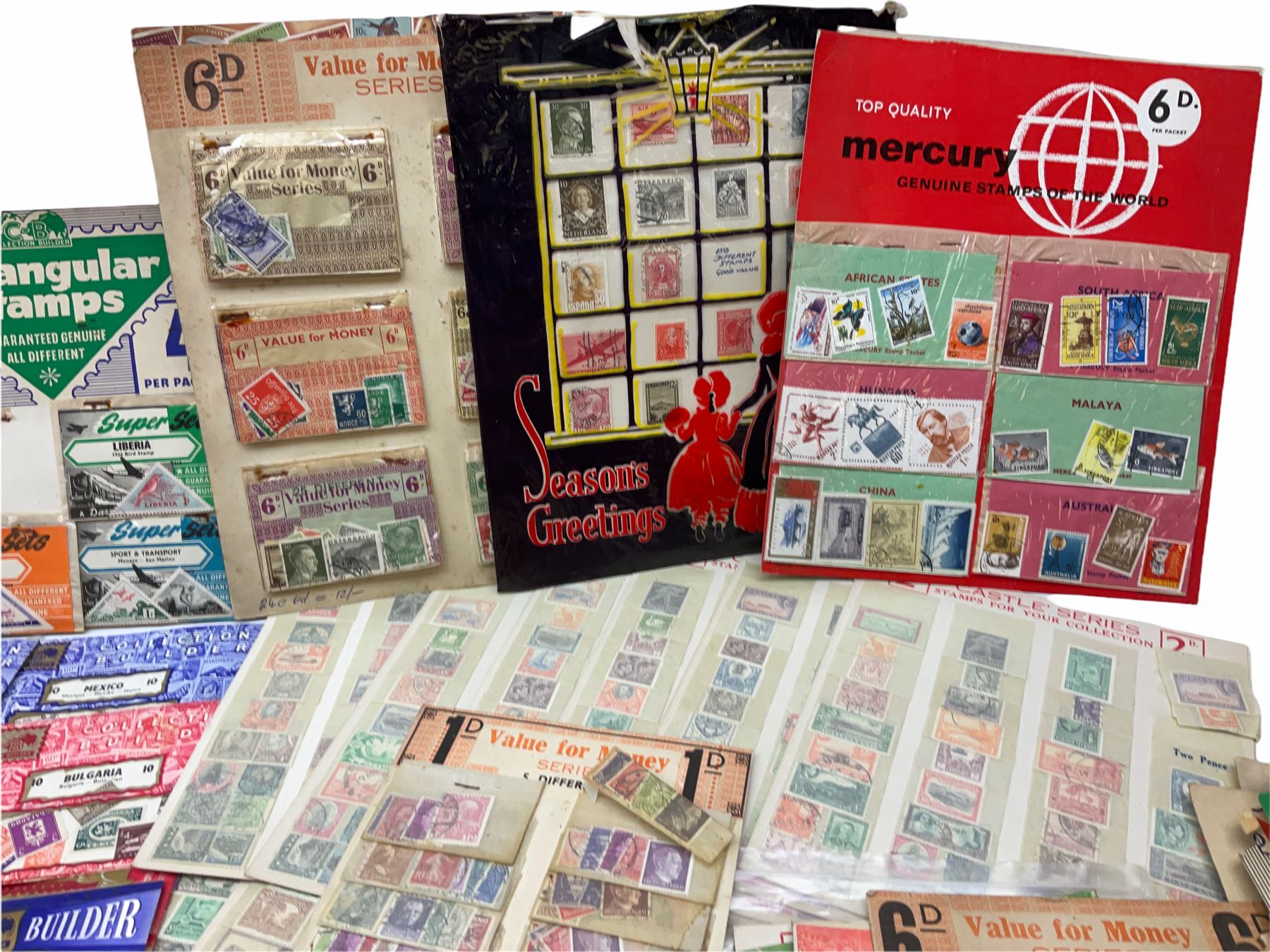 Collection of stamps including packets still mounted to the original shop cards, reading 'A Darracott Product Stamps 1d per pkt' etc, Countries include China, Spain, Argentina, Liberia, Denmark etc, in one box