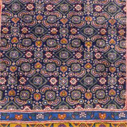 North West Persian Bidjar hand-knotted runner, decorated with an all-over herati pattern on a deep indigo ground, the field is filled with a repeating diamond and rosette motifs, interspersed with stylized leaves and floral elements, framed by a border on an ochre ground flanked by contrasting guard borders, with cotton fringe ends 